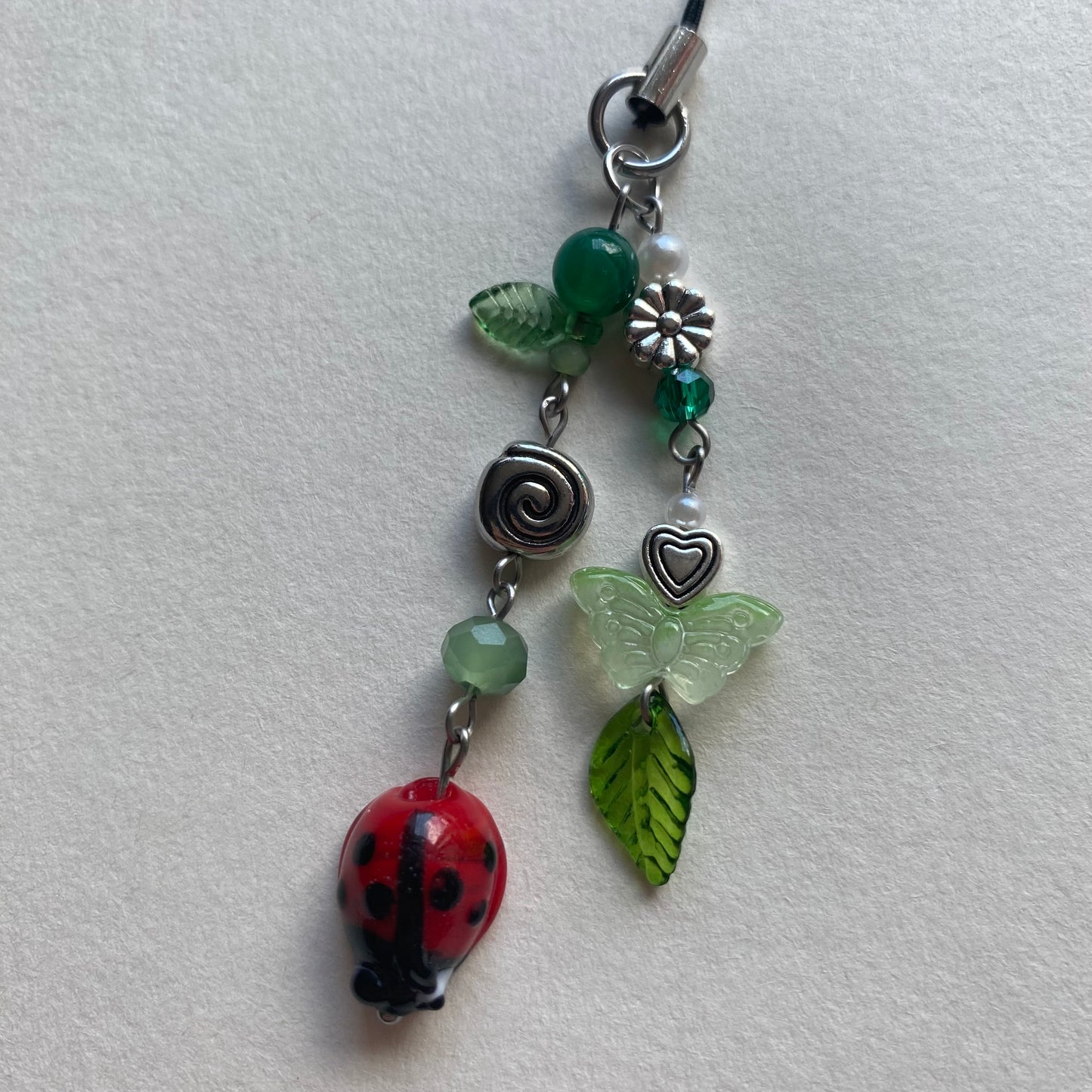 ladybug swirl phone charm