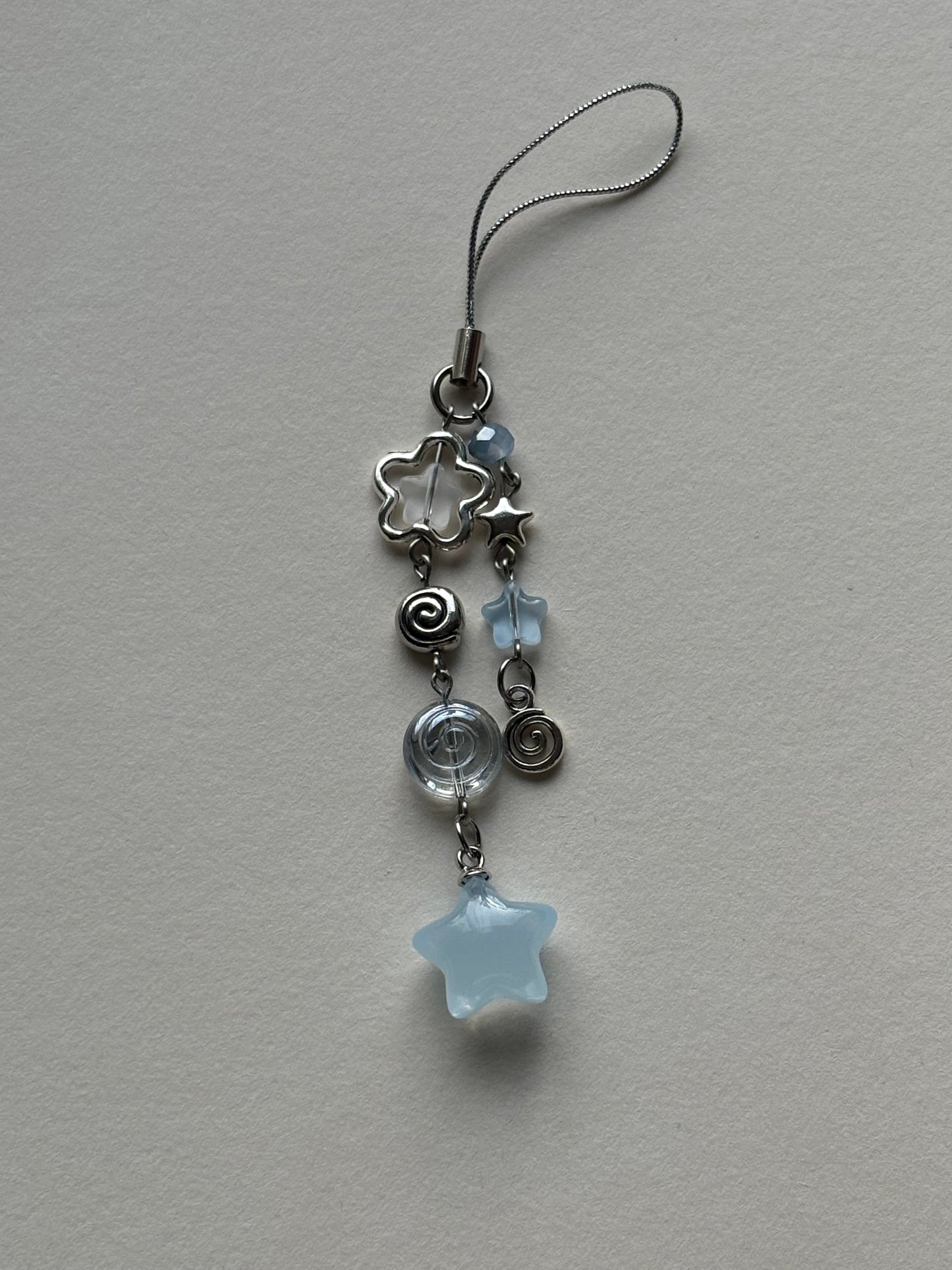 swirly star phone charm