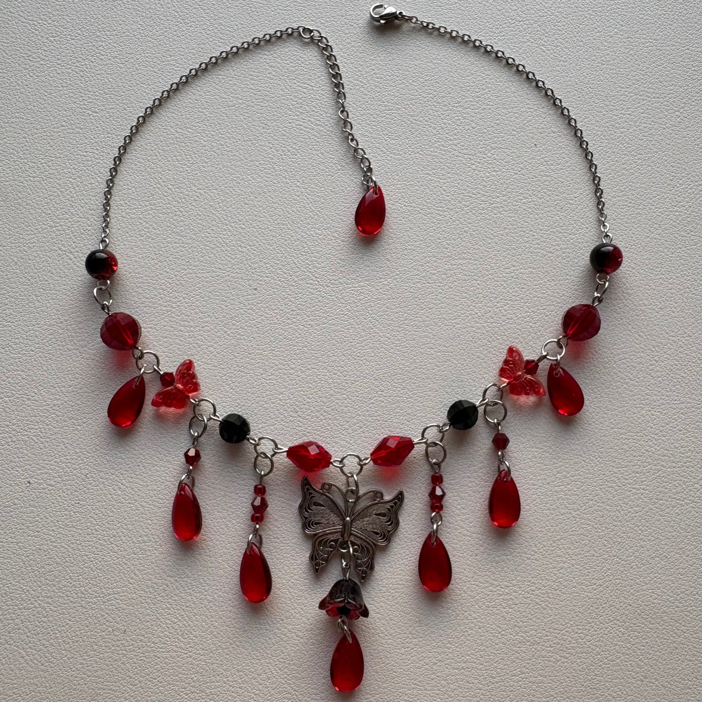 red and black butterfly necklace