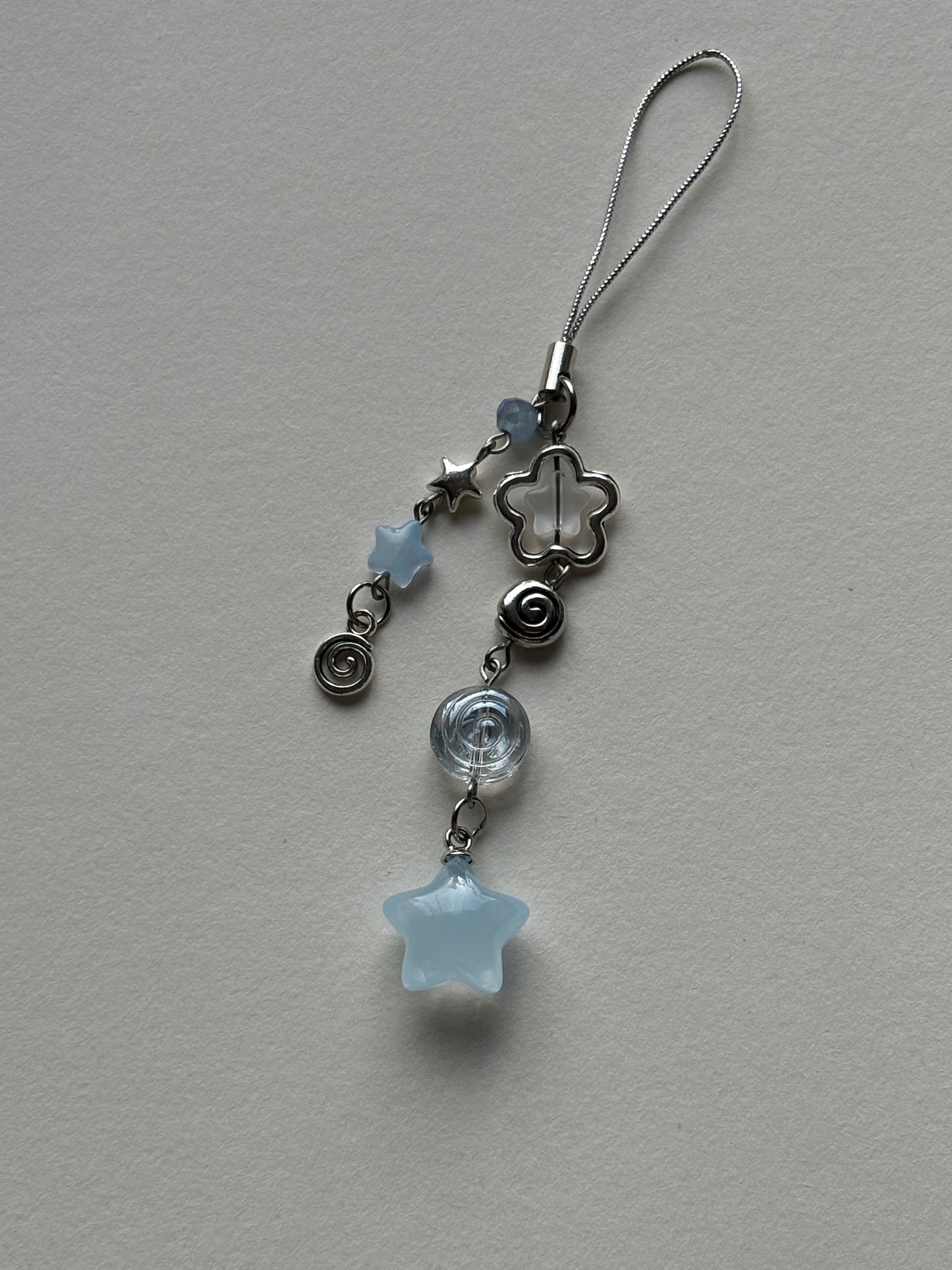 swirly star phone charm