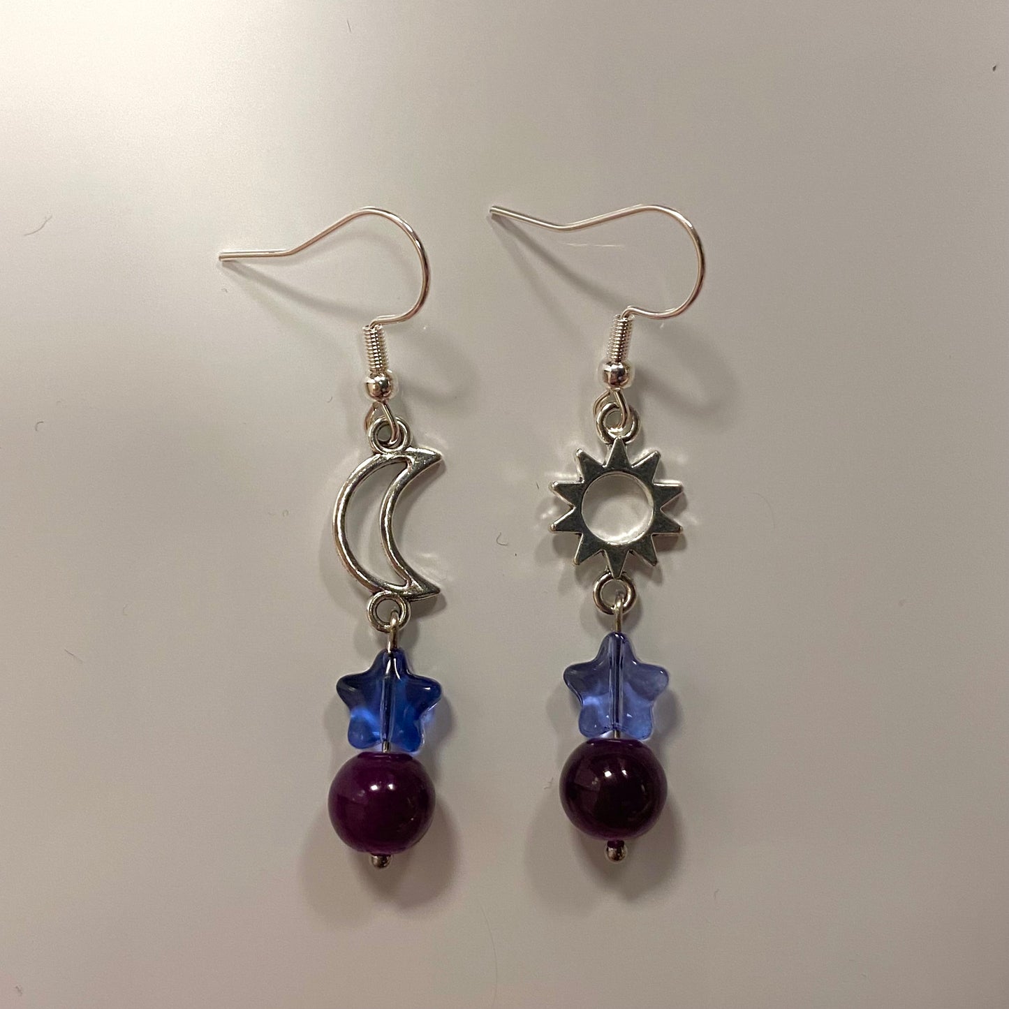 purple anomaly earrings