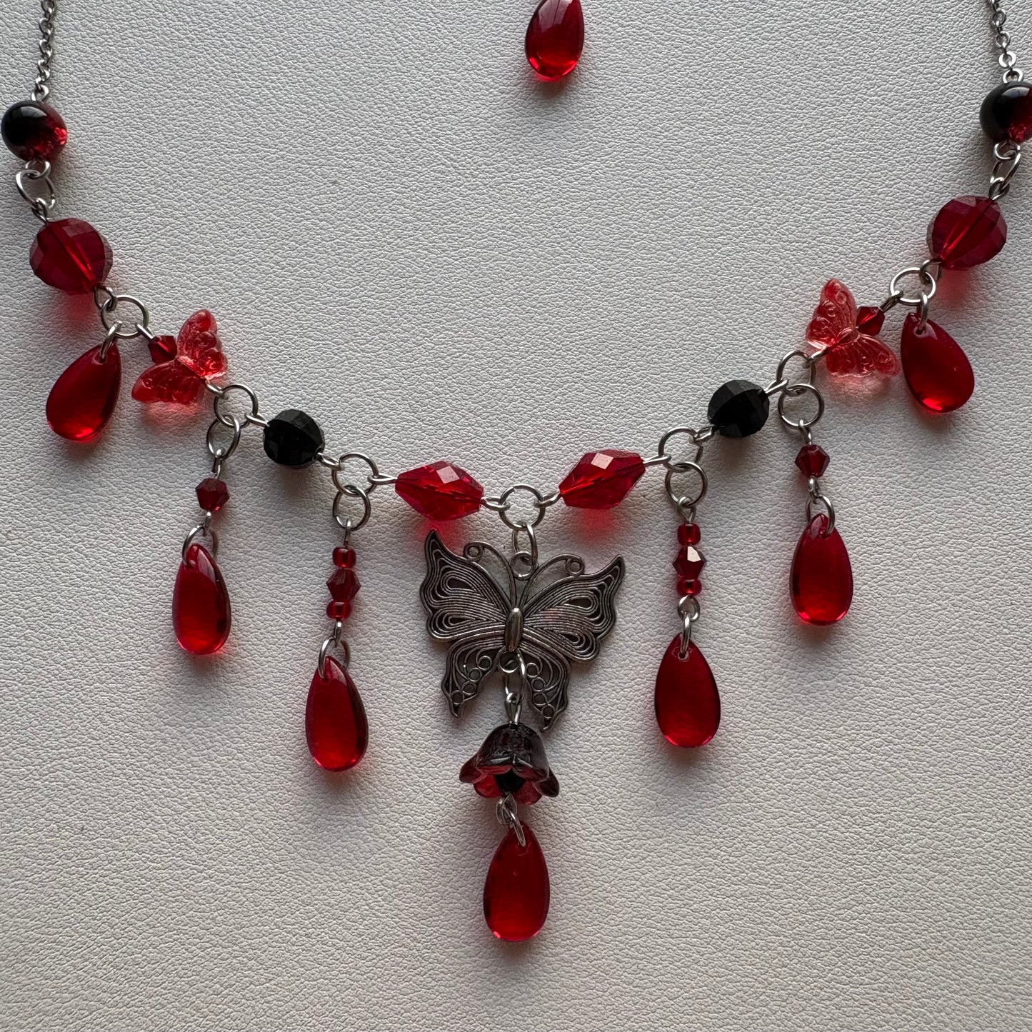 red and black butterfly necklace